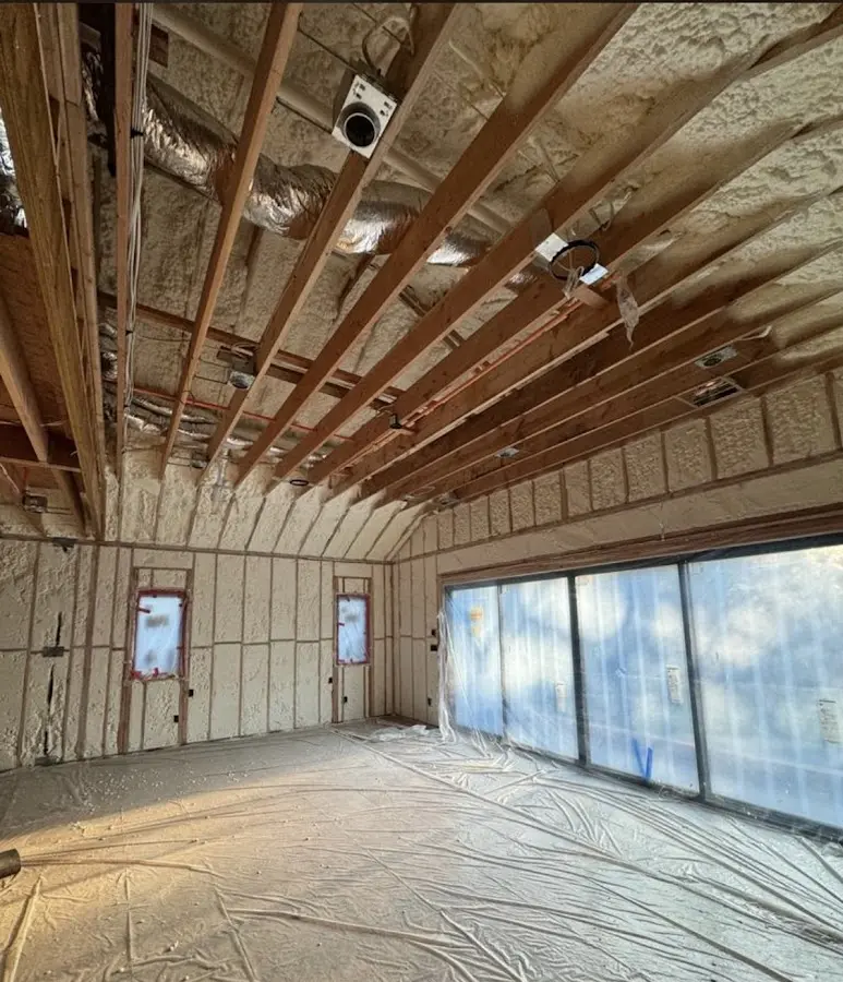 Interior walls and ceiling insulated with spray foam during new construction in Plattekill
